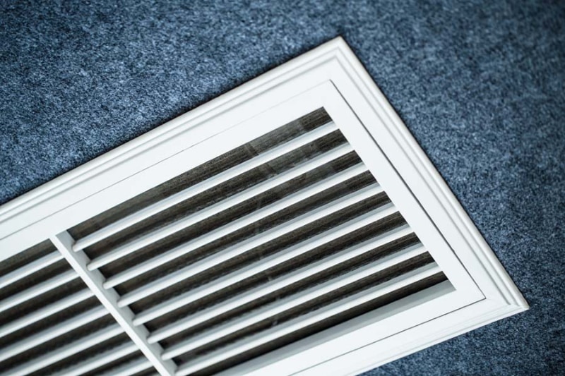 5 Ways To Improve Your Indoor Air Quality - Close-up shot of the vents of an air conditioner